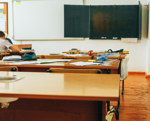 Empty classroom with school supplies, black board