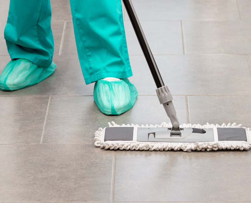 Floor care and cleaning services with washing mop in sterile operating room